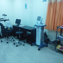 Therapist assisting a patient with resistance band exercises at Progressive Care clinic