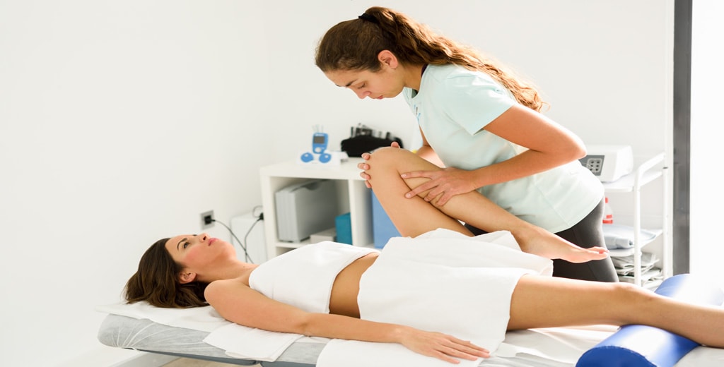 Physiotherapist guiding a patient through a shoulder rehabilitation exercise at Progressive Care, Hyderabad