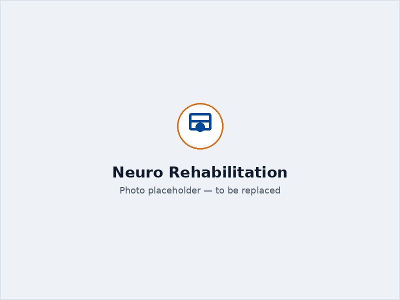 Therapist supporting a patient's balance and gait during neurological rehabilitation