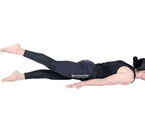 Practitioner in Ardha Shalbhasana, the Half Locust pose